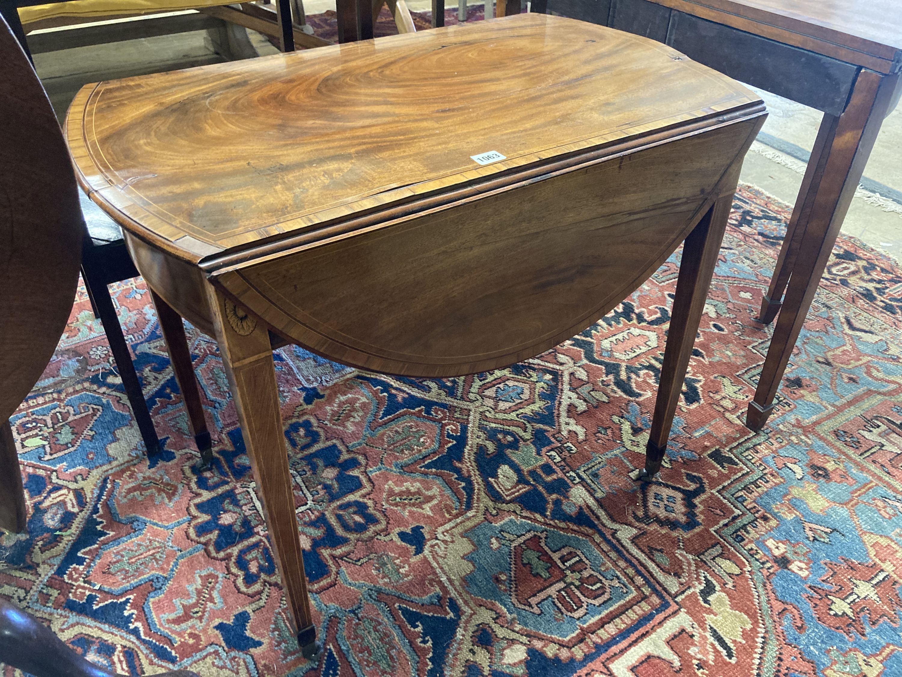 A George III rosewood banded and inlaid mahogany oval Pembroke table, width 79cm depth 49cm, height 68cm